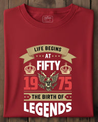 Red t-shirt with birthday design on a wooden surface