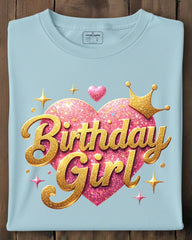 Light blue t-shirt with 'Birthday Girl' design on a wooden surface