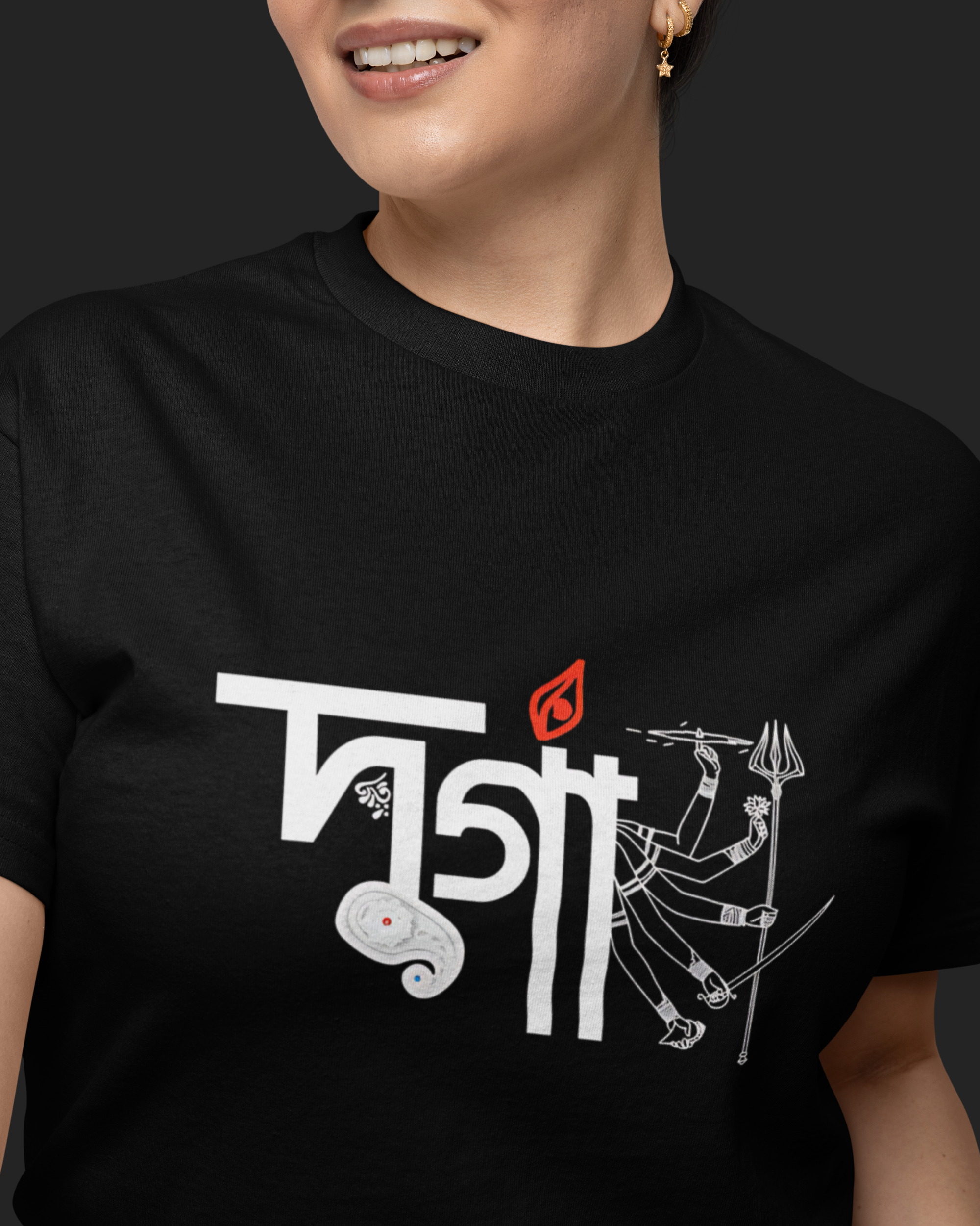 Person wearing a black t-shirt with white and red graphic design on a dark background