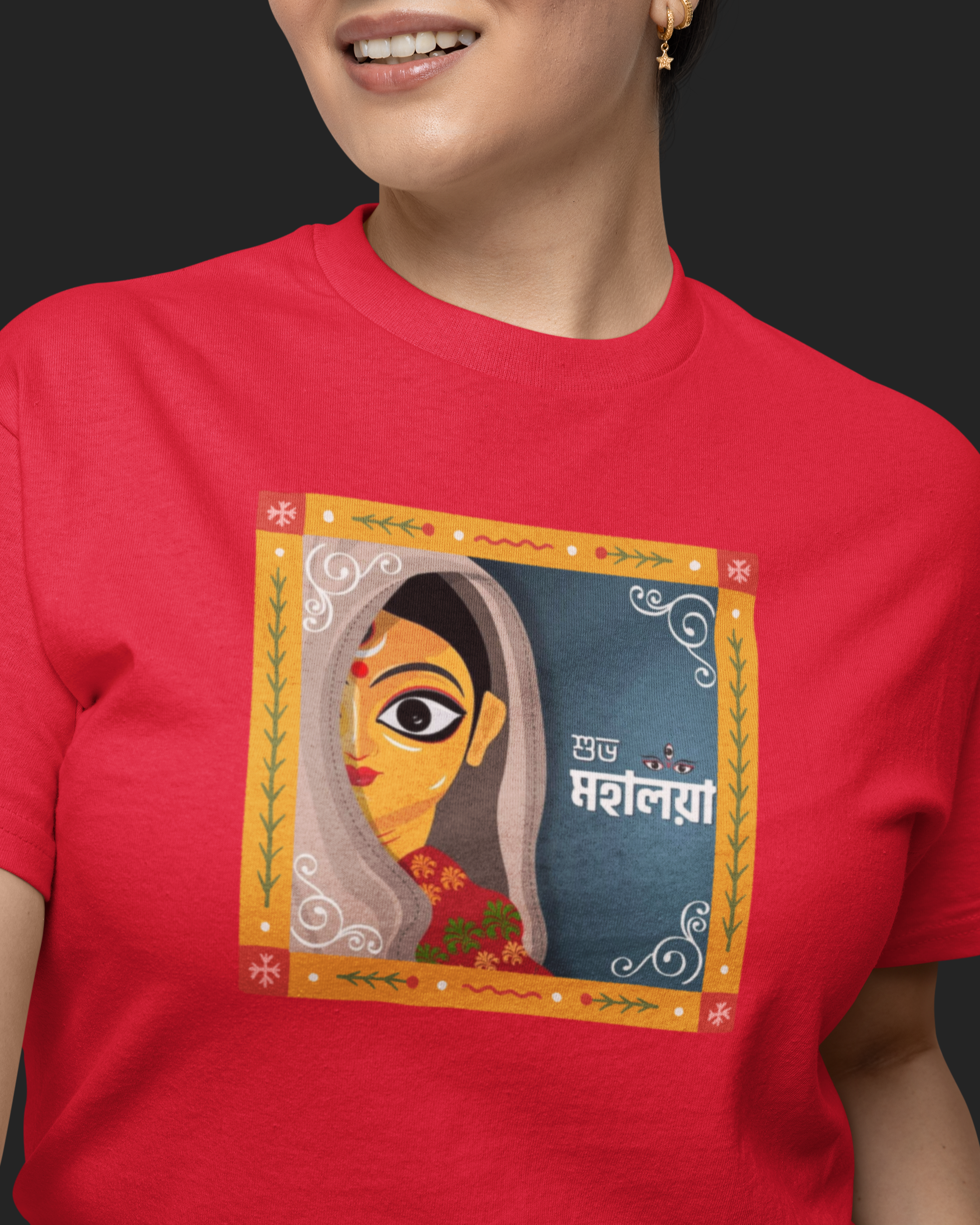 Person wearing a red t-shirt with a colorful graphic design on a black background