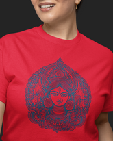 Person wearing a red t-shirt with a blue intricate design on a black background
