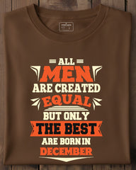 Brown t-shirt with a humorous quote on a wooden surface