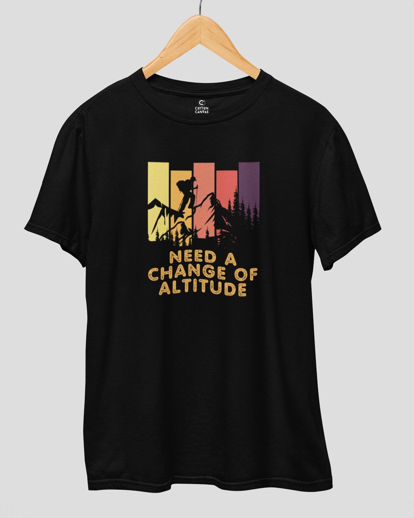 Black t-shirt with mountain graphic and text on a gray background