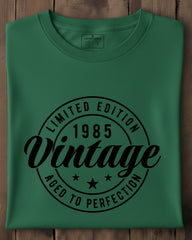 Green t-shirt with black text on a wooden surface