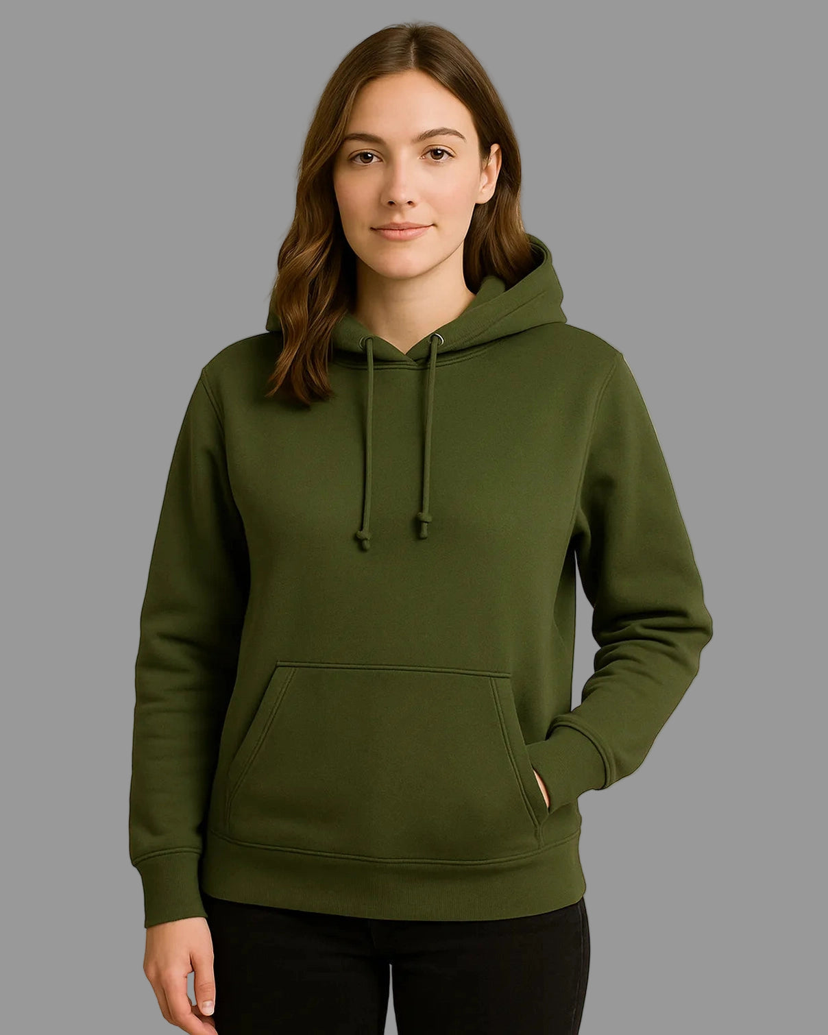 Woman wearing a green hoodie against a beige background
