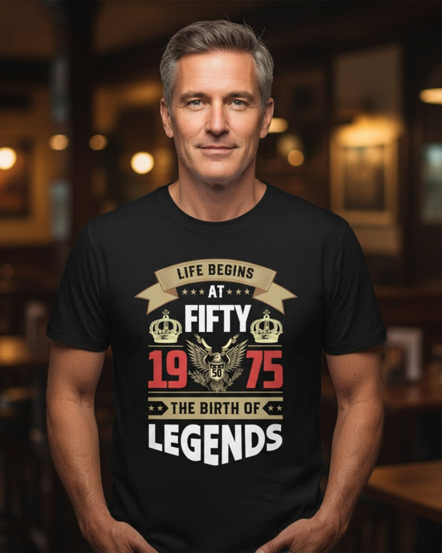 Man wearing a black t-shirt with a celebratory design in a bar setting