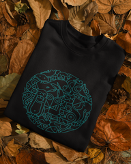 Black sleeveless shirt with blue geometric design on a bed of autumn leaves