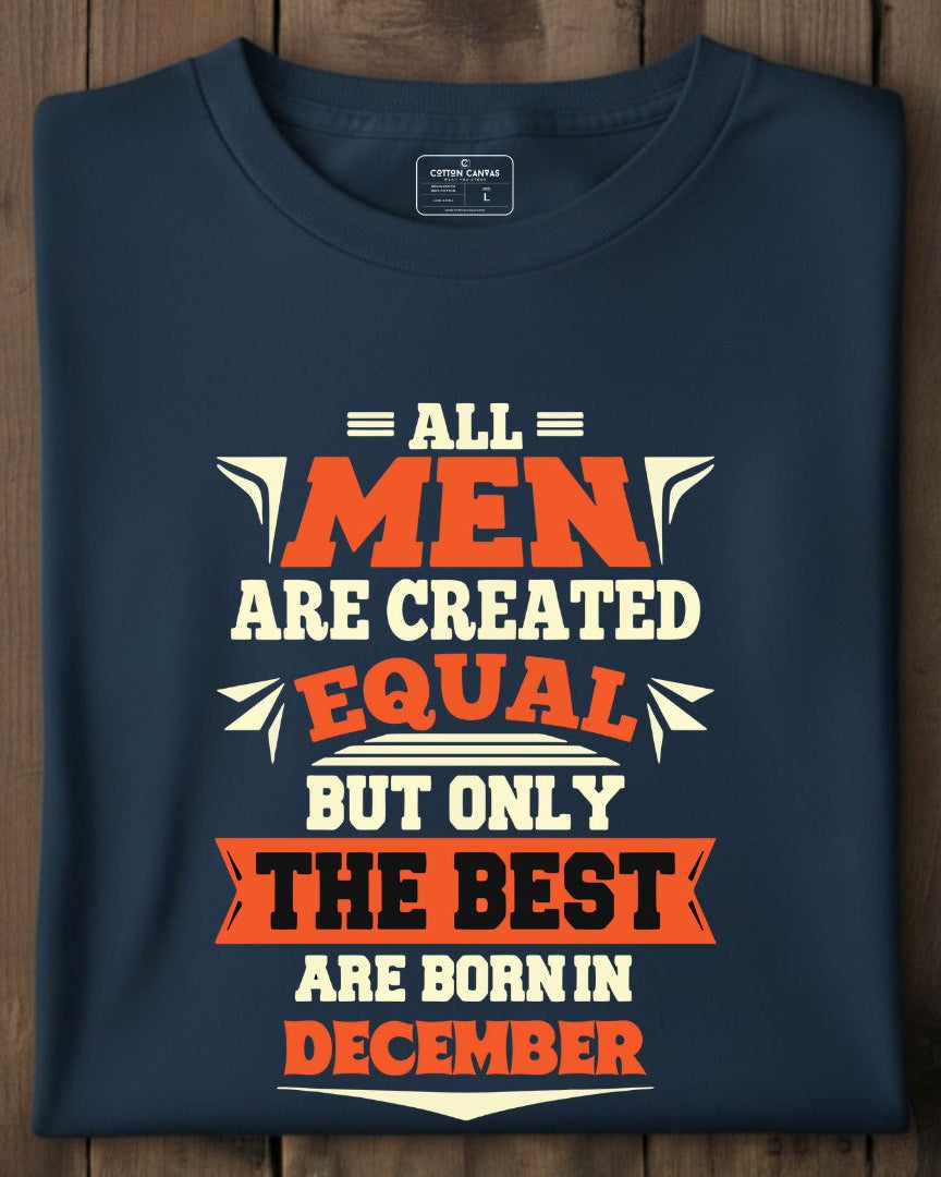 Folded navy blue t-shirt with humorous text design on a wooden surface