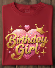 Red t-shirt with 'Birthday Girl' design on a wooden surface