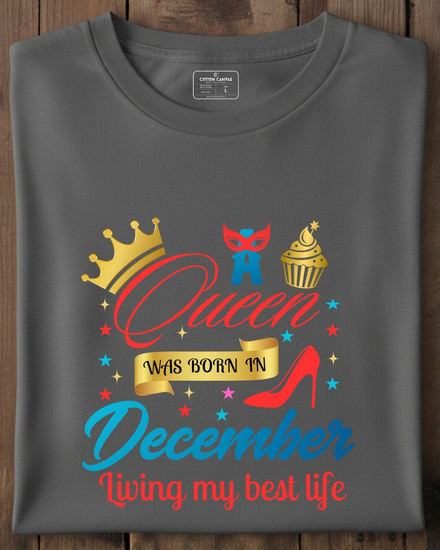 Gray t-shirt with colorful graphic design on a wooden surface
