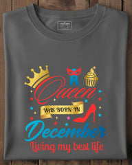 Gray t-shirt with colorful graphic design on a wooden surface