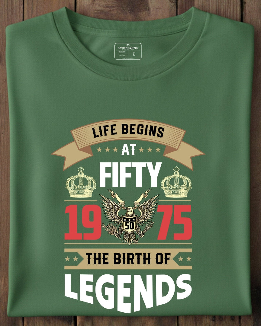 Green t-shirt with birthday design on a wooden surface