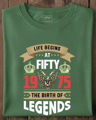 Green t-shirt with birthday design on a wooden surface