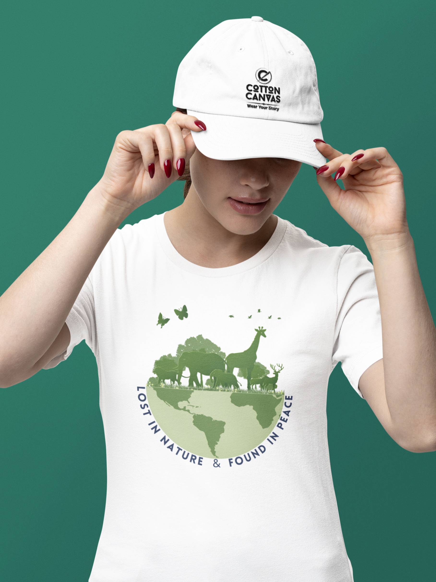 Person wearing a white t-shirt with a green graphic and a white cap on a green background