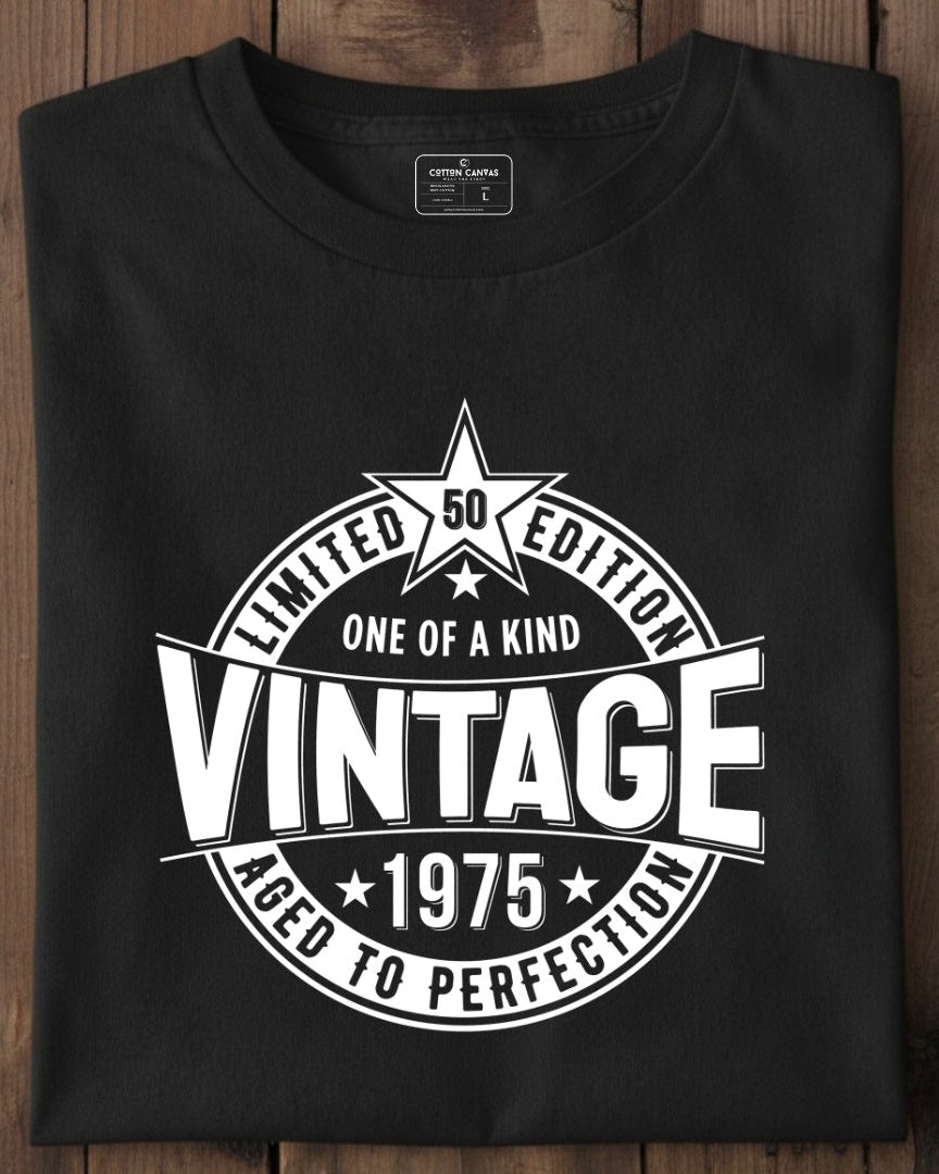 Black t-shirt with vintage design on a wooden surface