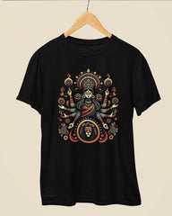 A black short-sleeve t-shirt hanging on a wooden hanger against a light beige background. The shirt features a large, detailed graphic print of a Hindu goddess with multiple arms, surrounded by intricate circular patterns and a lion emblem at the bottom.