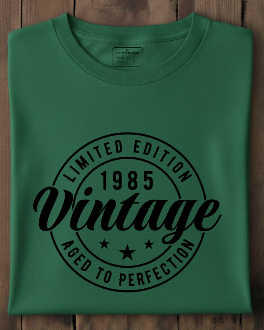 Green t-shirt with black text on a wooden surface