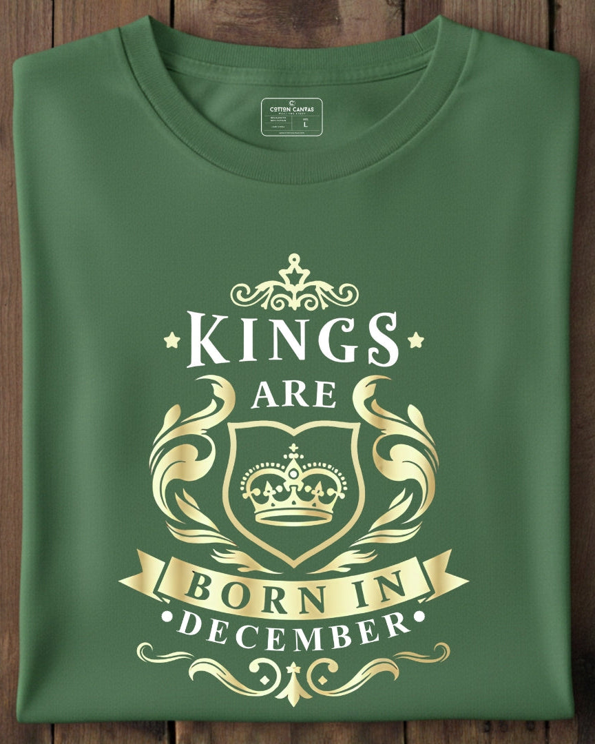 Green t-shirt with gold text and design on a wooden surface