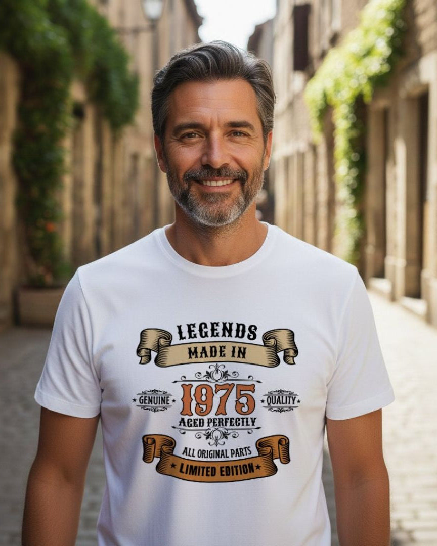 Man wearing a white t-shirt with a vintage-style text design in an outdoor setting.