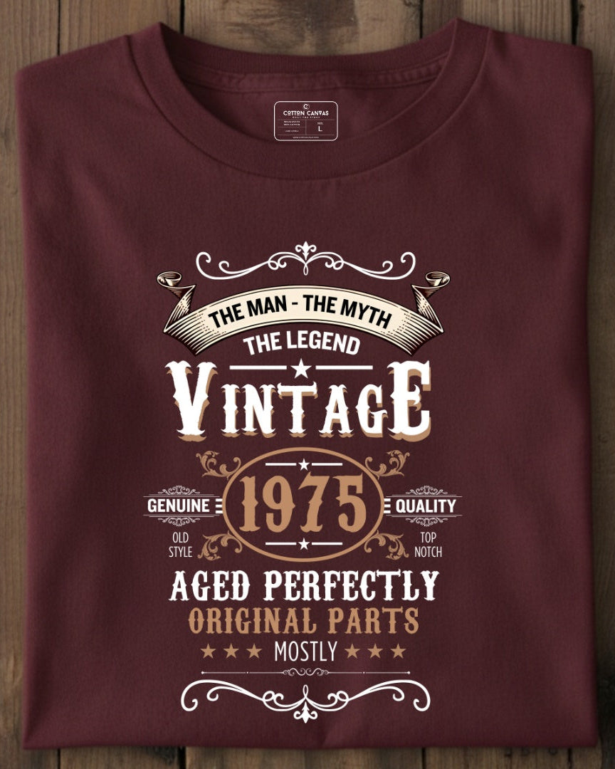 Maroon t-shirt with vintage design on a wooden surface