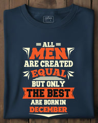 Folded navy blue t-shirt with humorous text design on a wooden surface