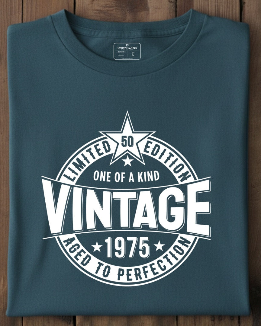 Folded blue t-shirt with vintage design on a wooden surface