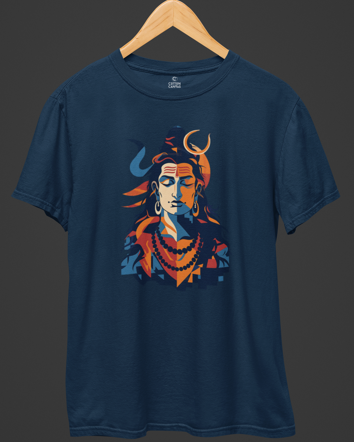 Navy blue t-shirt with a colorful graphic design on a wooden hanger against a dark background
