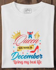 White t-shirt with colorful graphic design on a wooden surface
