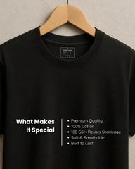 Black t-shirt on a hanger with text detailing its features.